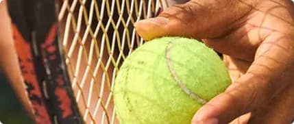 Holding a tennis ball