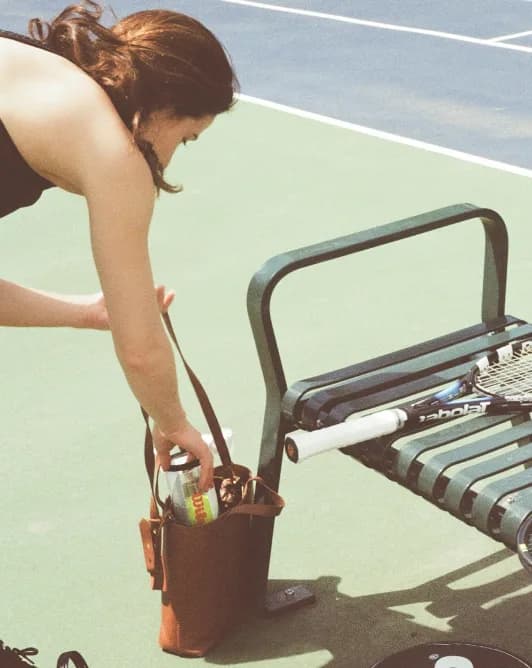 Tennis player, getting ready court-side